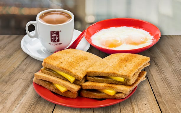 Kaya toast with soft-boiled eggs and coffee, part of FunVee Open-Top Bus Tour breakfast.