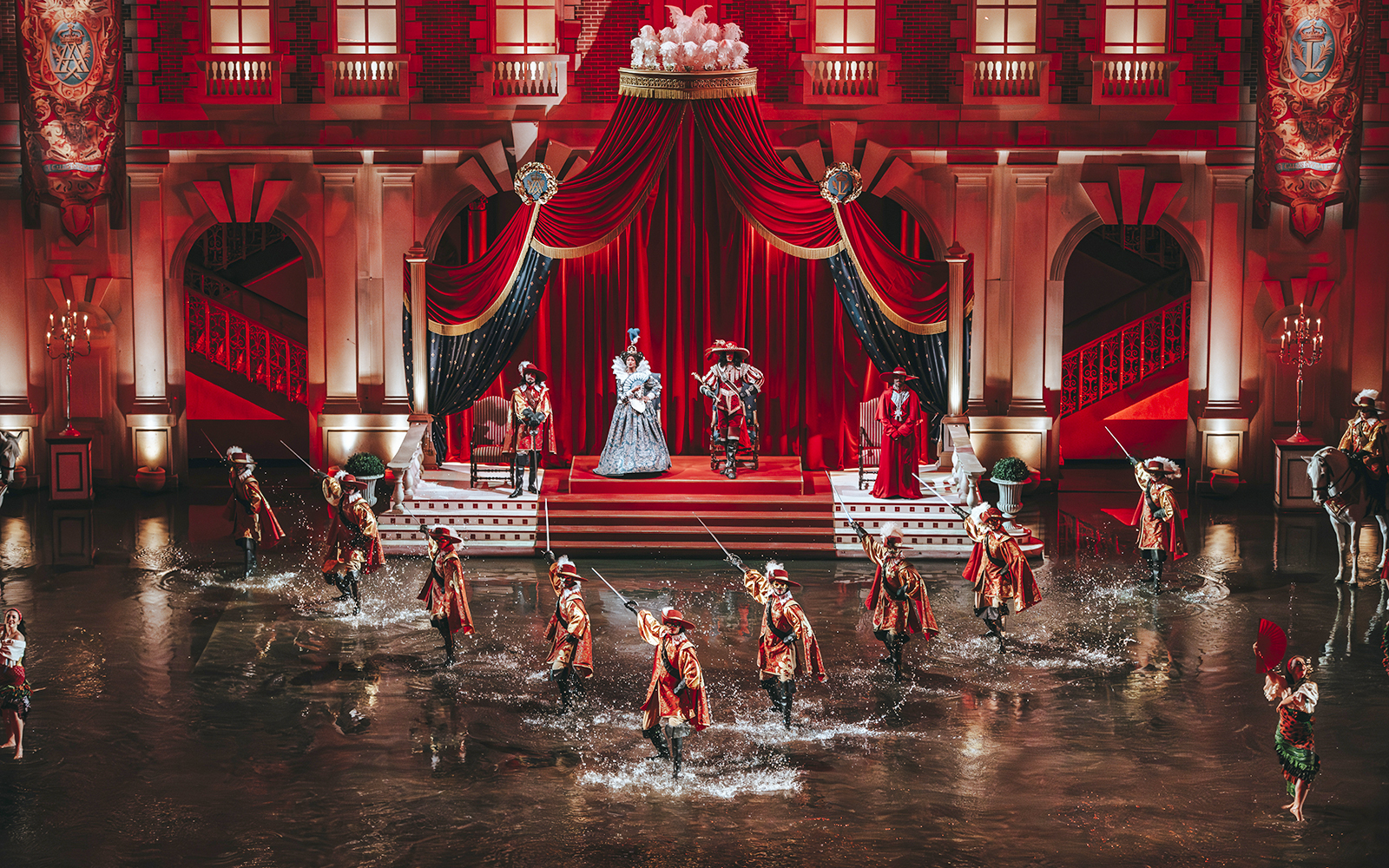 Performers in historical costumes during a show at Puy du Fou, France.