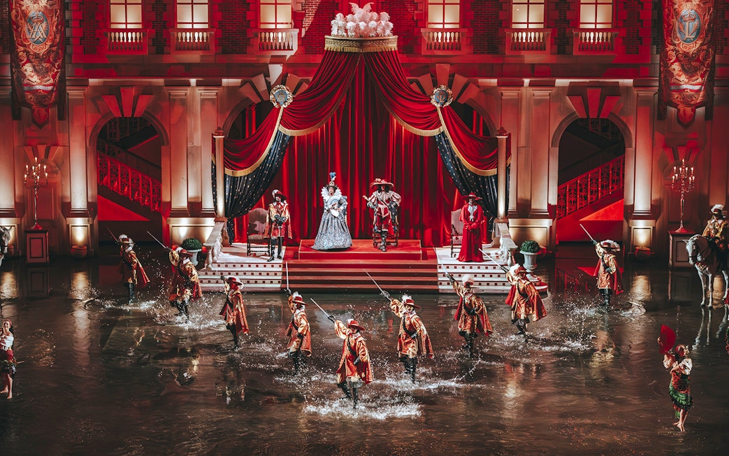 Performers in historical costumes during a show at Puy du Fou, France.