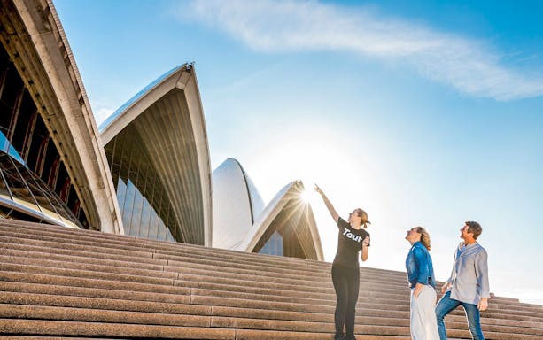 Guide with couple at Sydney Opera House using Sydney Explorer Pass.