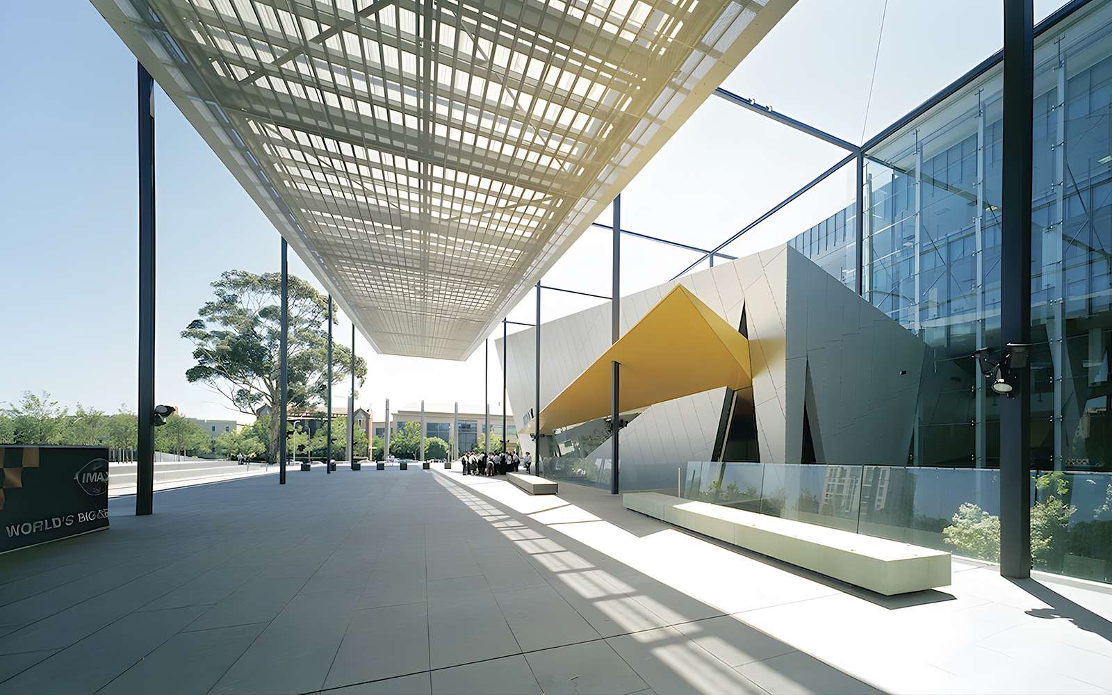 Melbourne Museum modern entrance with architectural canopy and visitors.