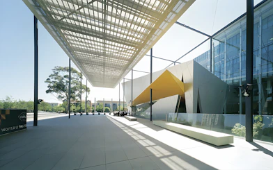 Melbourne Museum modern entrance with architectural canopy and visitors.