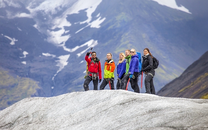 Guests hiking and ice climbing on a glacier in Skaftafell, Iceland.