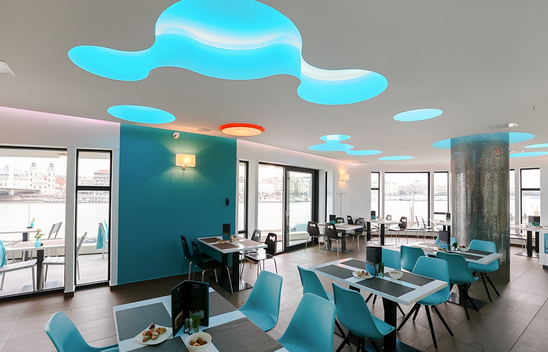 Indoor seating area at a restaurant in Rudas Bath, Budapest.