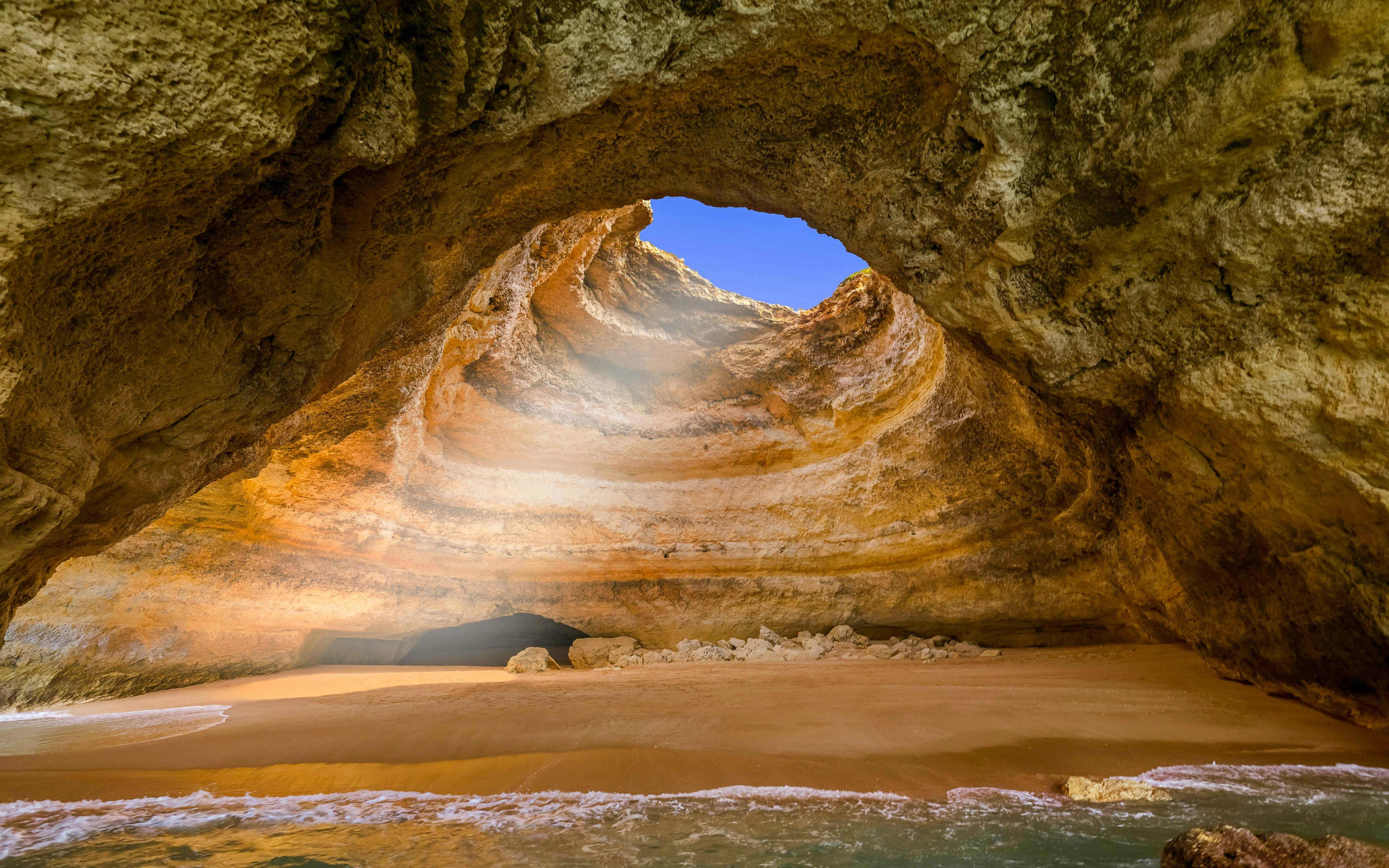 Sea cave with sandy beach near Lagos, Algarve, Portugal.