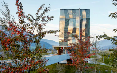 Swarovski Crystal Worlds entrance with modern glass architecture in Tyrol, Austria.