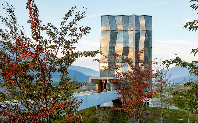 Swarovski Crystal Worlds entrance with modern glass architecture in Tyrol, Austria.