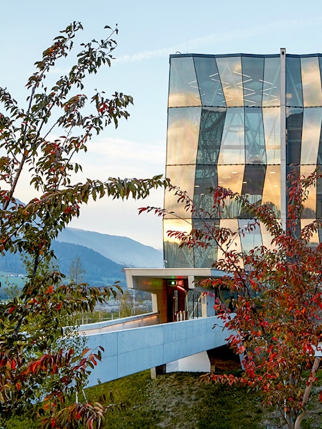 Swarovski Crystal Worlds entrance with modern glass architecture in Tyrol, Austria.