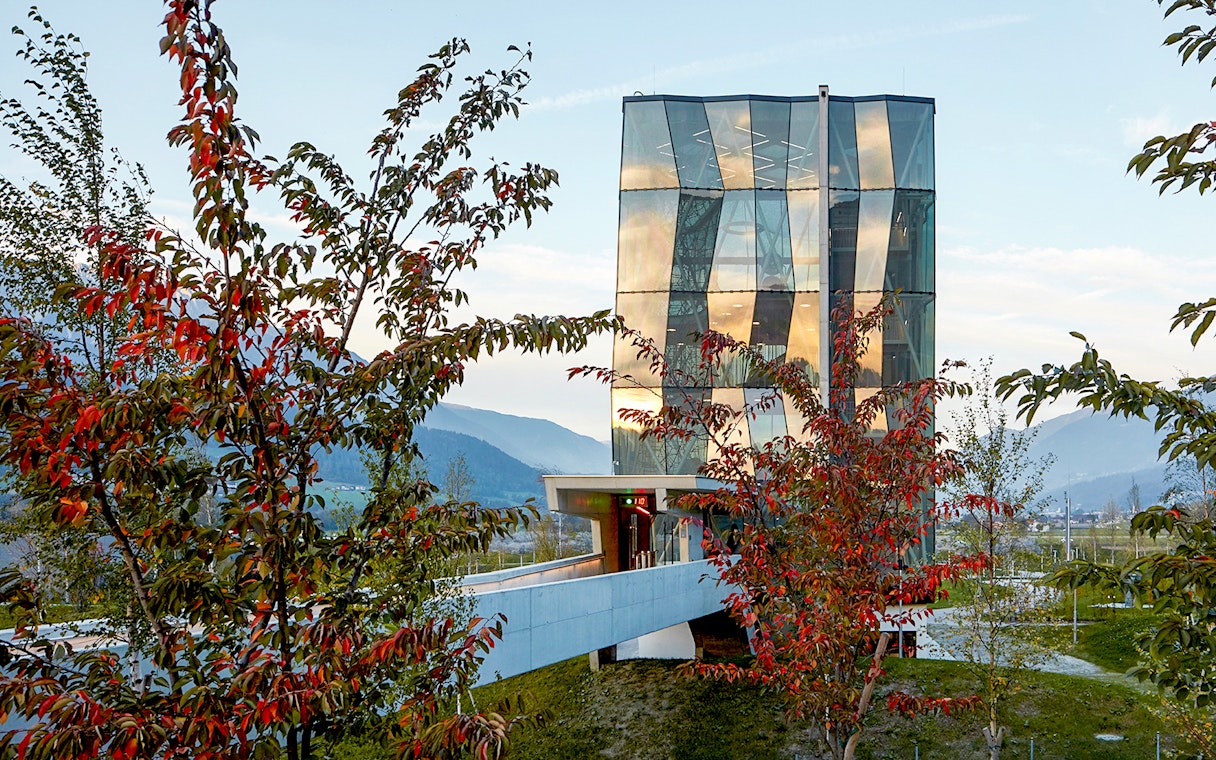 Swarovski Crystal Worlds entrance with modern glass architecture in Tyrol, Austria.