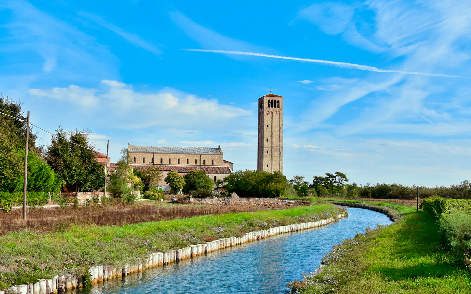 Ancient church and canal on Torcello Island near Venice.
