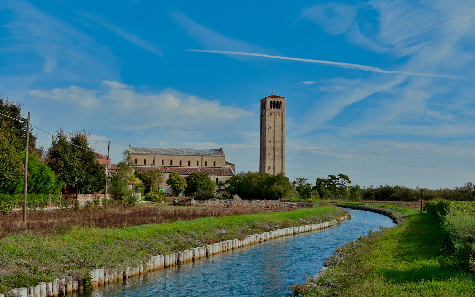 Ancient church and canal on Torcello Island near Venice.