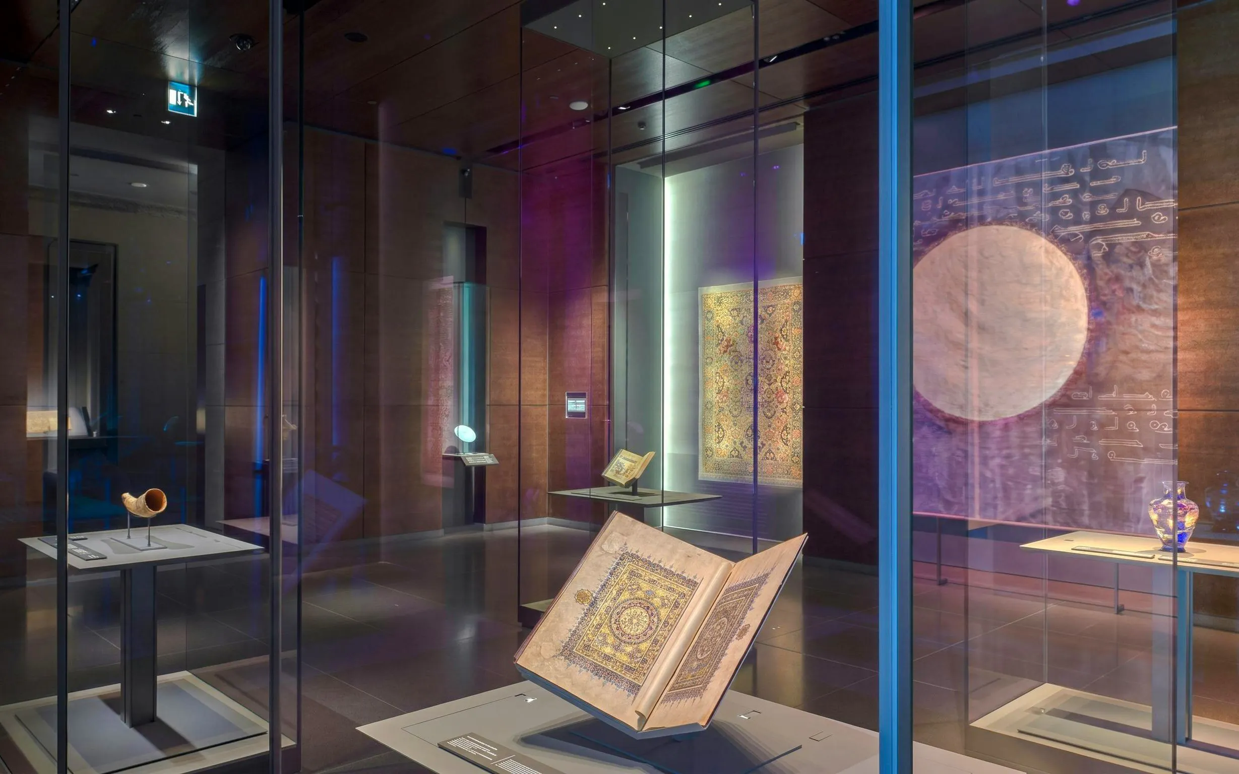 Museum of Islamic Art in Doha showcasing illuminated manuscripts and artifacts.