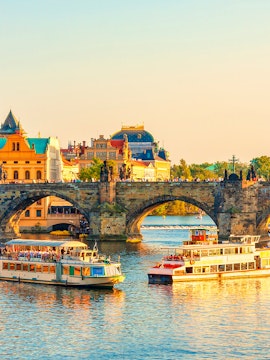 Boats on the Vltava River near Charles Bridge in Prague's Old Town.