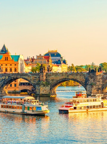 Boats on the Vltava River near Charles Bridge in Prague's Old Town.