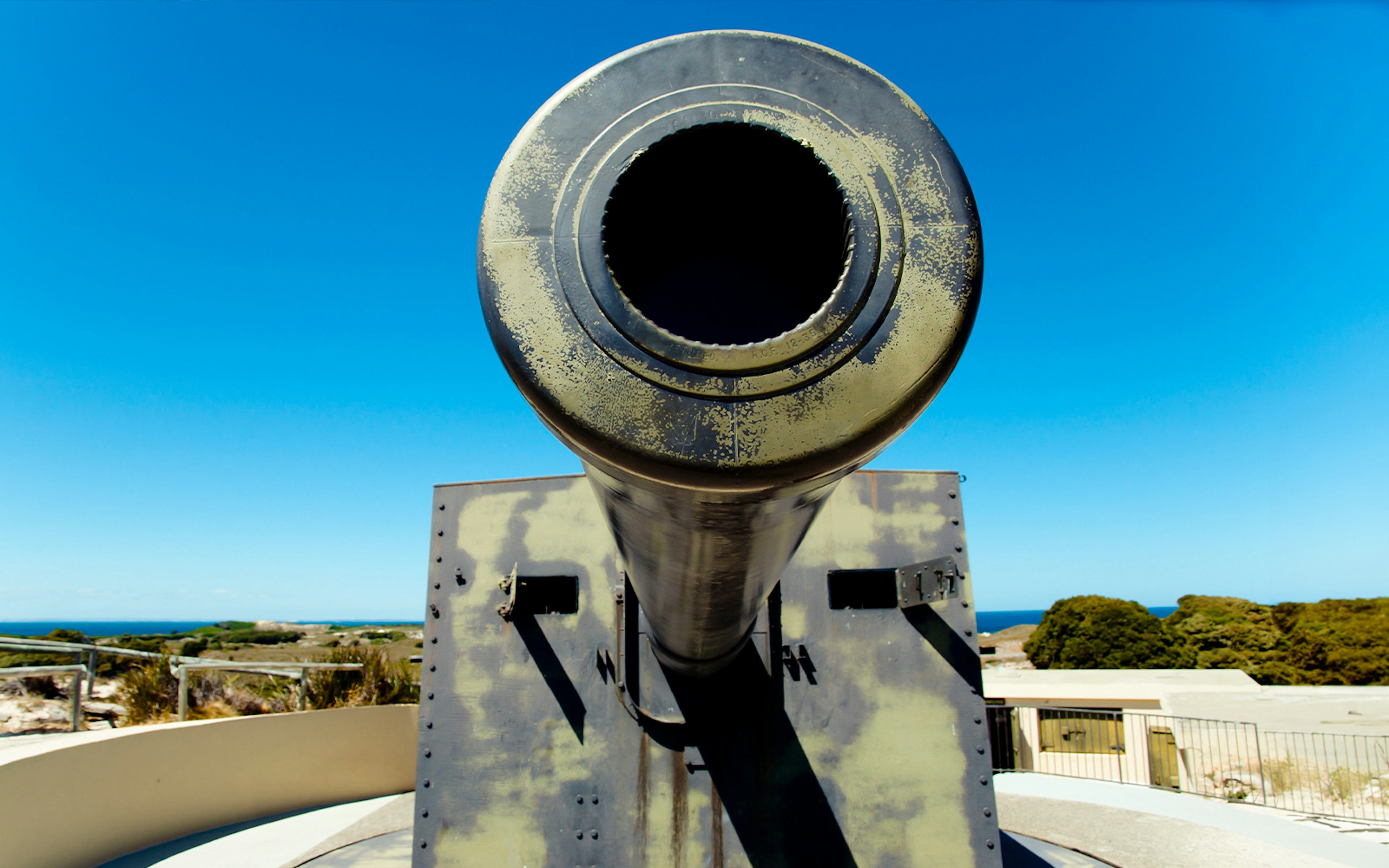 Wadjemup Lighthouse on Rottnest Island with surrounding landscape and ocean.