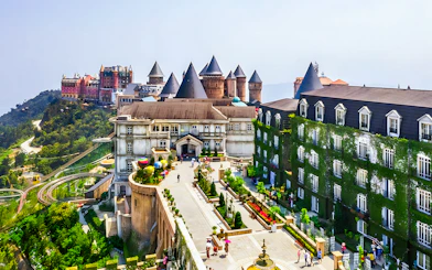 Sun World Ba Na Hills castle-like buildings and gardens with cable car in Da Nang, Vietnam.