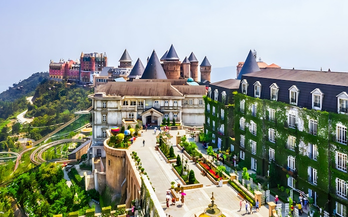 Sun World Ba Na Hills castle-like buildings and gardens with cable car in Da Nang, Vietnam.