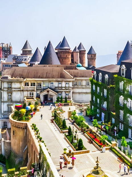 Sun World Ba Na Hills castle-like buildings and gardens with cable car in Da Nang, Vietnam.