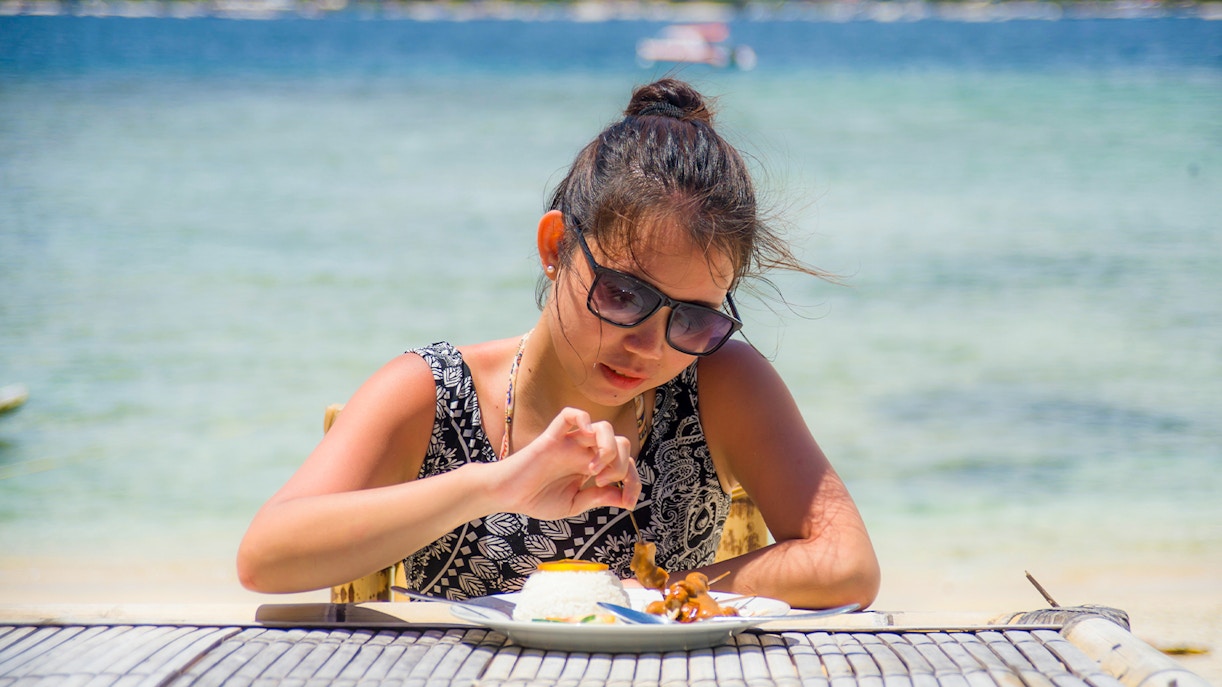 Group of tourists exploring the scenic West Nusa Penida Island with hotel transfers included in Bali, Indonesia