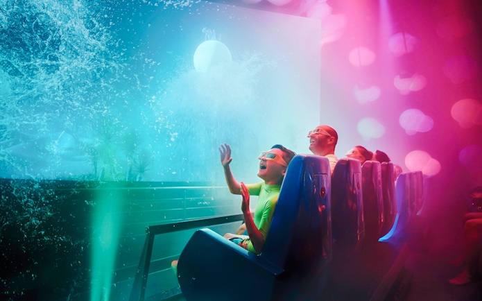 Family enjoying Cinesplash ride at YAS Waterworld, Abu Dhabi.