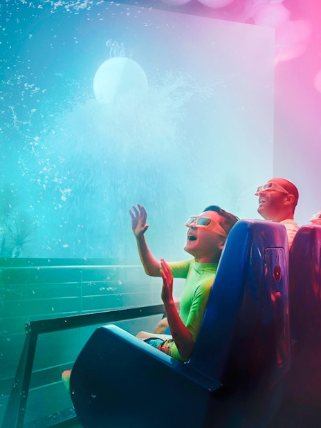 Family enjoying Cinesplash ride at YAS Waterworld, Abu Dhabi.