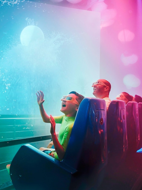 Family enjoying Cinesplash ride at YAS Waterworld, Abu Dhabi.