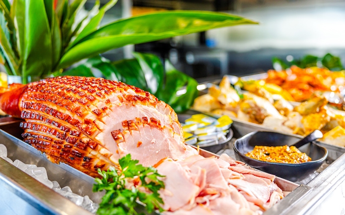 Buffet spread with sliced ham and condiments at Gold Coast lunch.