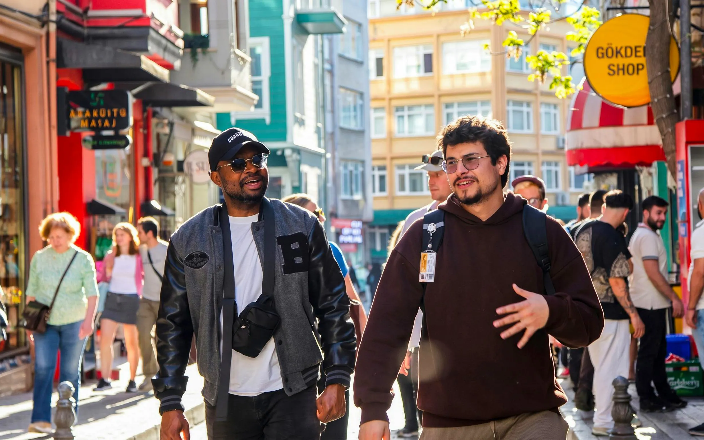 Tourists exploring a vibrant street during an Istanbul food tour.