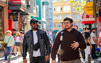 Tourists exploring a vibrant street during an Istanbul food tour.