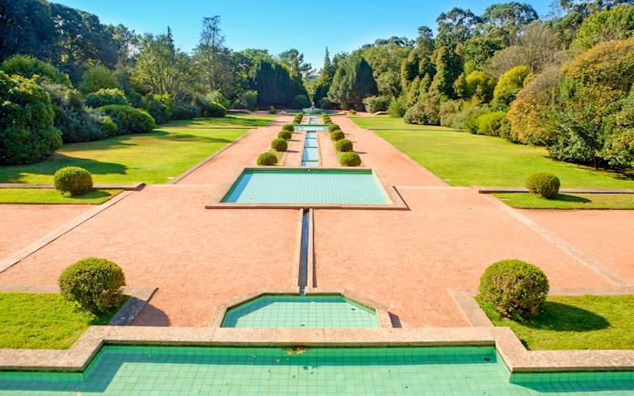 Serralves garden with geometric water features and manicured hedges in Porto, Portugal.