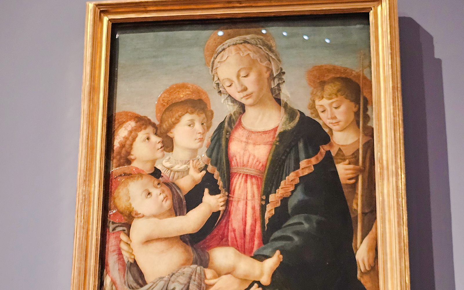 Madonna and Child with St. John and angel painting in Accademia Gallery, Florence.
