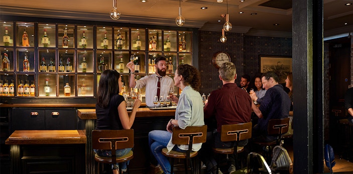 Jameson Distillery blending class in Dublin with participants crafting Black Barrel whiskey.
