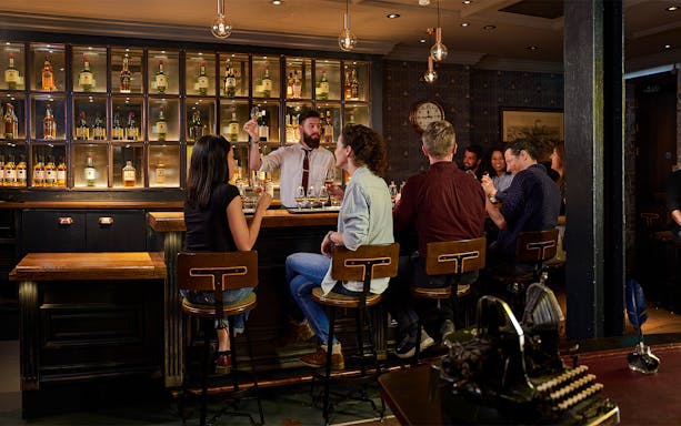 Jameson Distillery blending class in Dublin with participants crafting Black Barrel whiskey.
