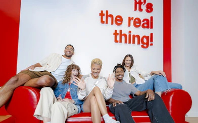 Group of friends enjoying inside World of Coca-Cola Museum, Atlanta.