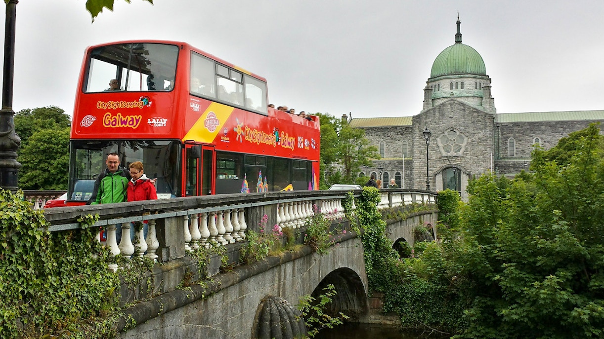 Galway hop on hop off tour bus infront of Galway cathedral