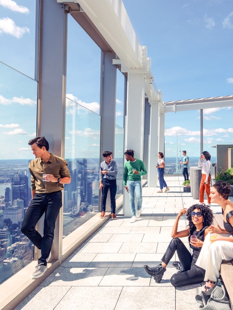Group enjoying views from SUMMIT One Vanderbilt observation deck, New York City.