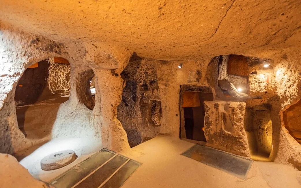 Inside view of Derinkuyu underground cave city with carved stone walls and passageways.