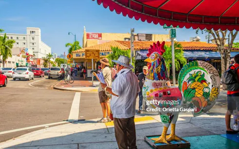 Little Havana street scene with colorful rooster statue and El Pub restaurant, Miami.
