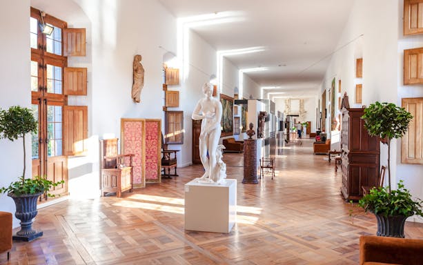 Château de Chenonceau interior hallway with sculptures, Loire Valley, France.