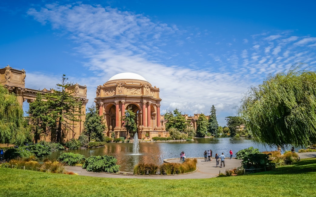 Palace of Fine Arts in San Francisco with people by the lagoon.