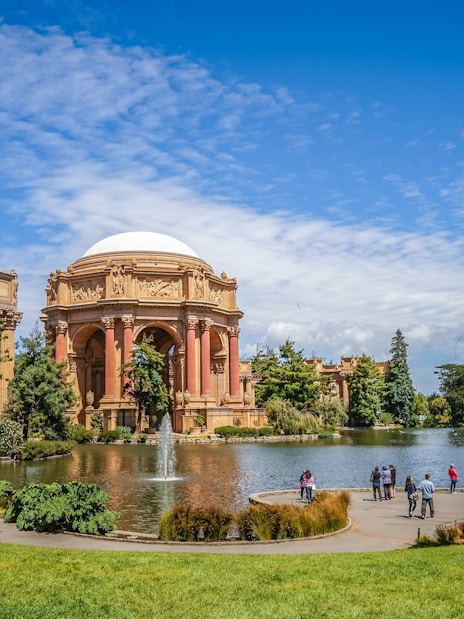 Palace of Fine Arts in San Francisco with people by the lagoon.