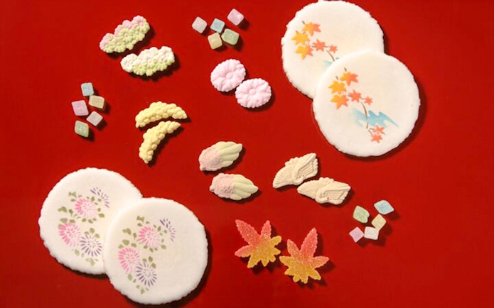 Traditional Japanese sweets on red background for Tokyo Matcha & Kimono Experience.