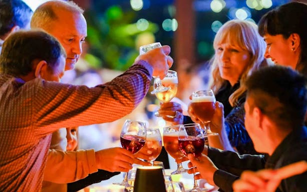Guests toasting on a Bosphorus dinner cruise.