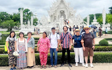 Visitors in front of the White Temple, Wat Rong Khun, Chiang Rai.
