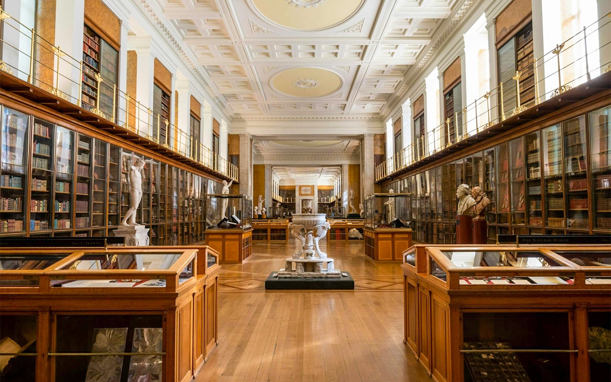 British Museum Enlightenment Room with statues and display cases.