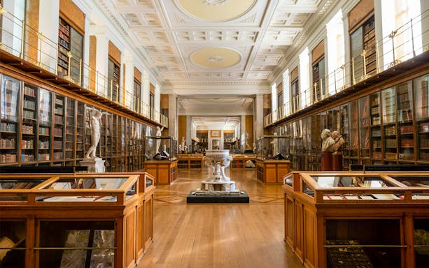 British Museum Enlightenment Room with statues and display cases.