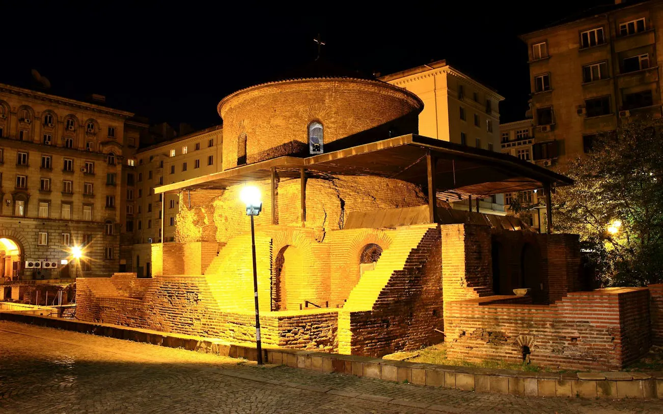 Rotunda of St. George in Sofia illuminated at night, part of Communist Sofia exploration game.