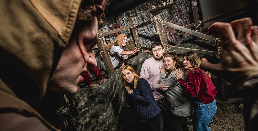 Visitors encounter actors portraying a cannibal clan at Edinburgh Dungeon.