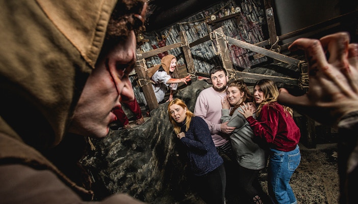 Cannibal Clan performance at Edinburgh Dungeon with actors in period costumes.
