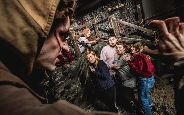 Cannibal Clan performance at Edinburgh Dungeon with actors in period costumes.